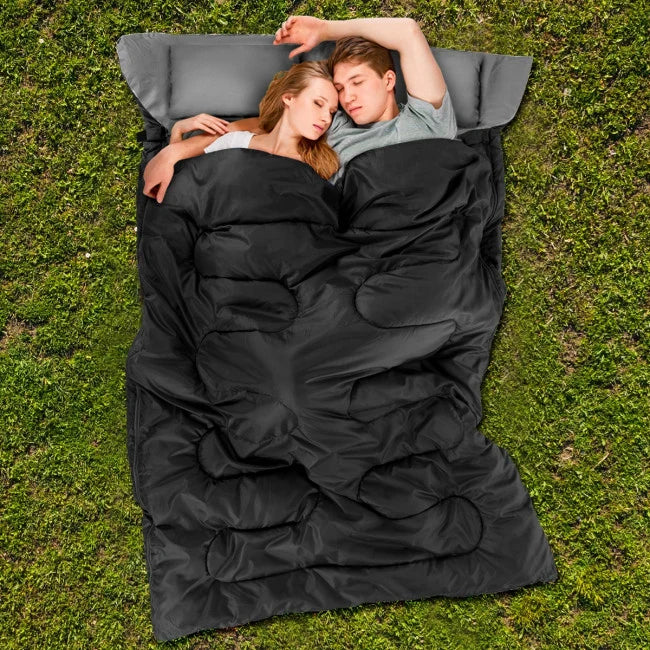 Emergency Sleeping Bag couple on the grass
